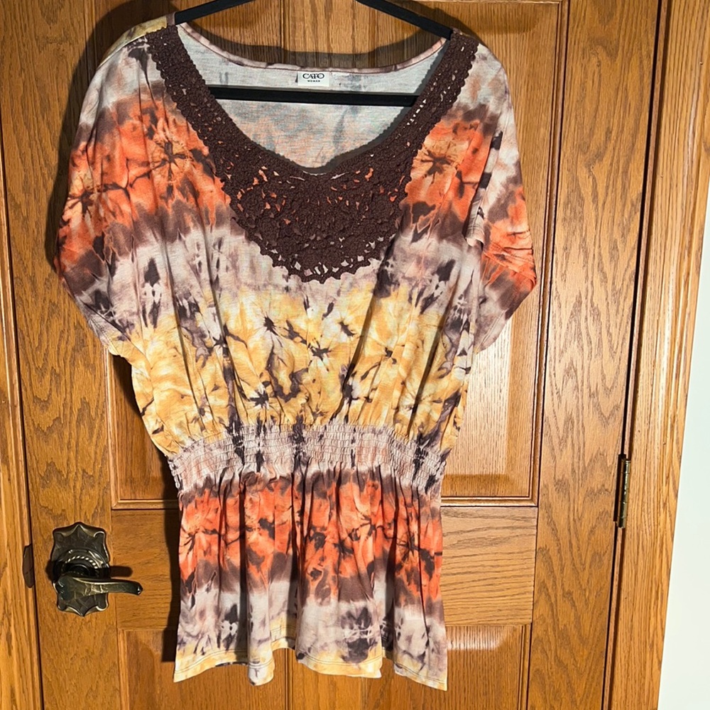 Brown crochet embellishment at neck